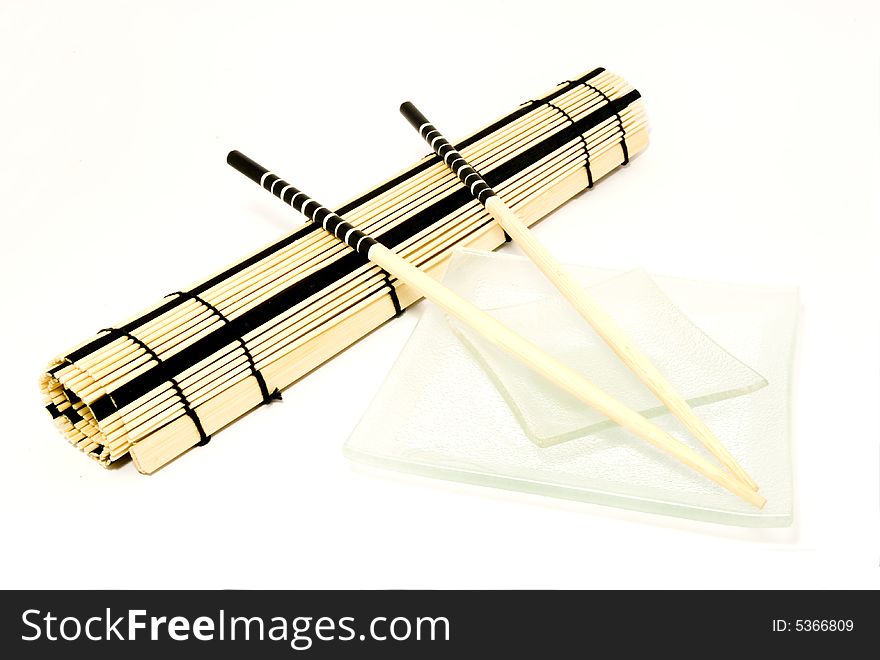 Sushi set with chop-sticks placed over white background. Sushi set with chop-sticks placed over white background
