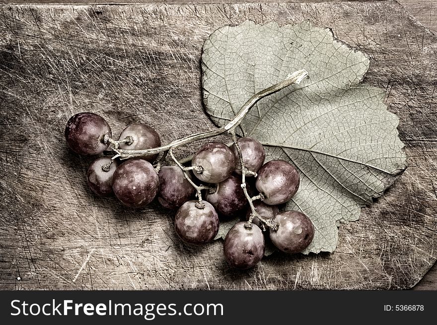 Grapes on wooden table, siolated. Grapes on wooden table, siolated.