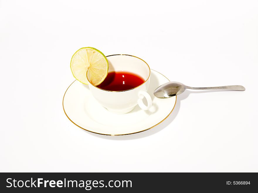 A porcelain cup of tea, placed over white background