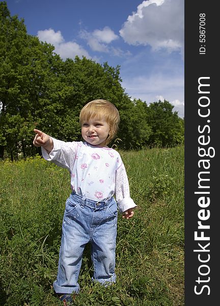 Cute little girl a background of a landscape. Cute little girl a background of a landscape