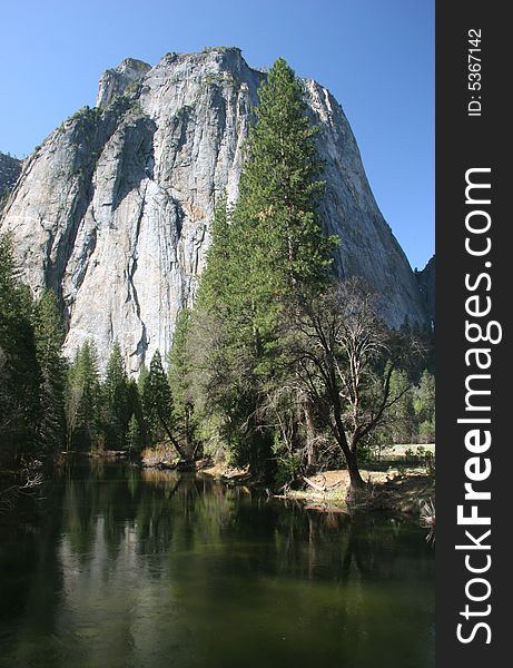 Famous natural landmark destination El Capitan, one of the magnificent mountains in Yosemite. Yosemite national park. California. USA. Famous natural landmark destination El Capitan, one of the magnificent mountains in Yosemite. Yosemite national park. California. USA