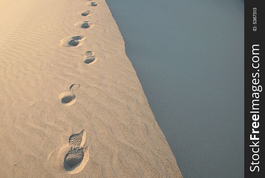 Footsteps in endless sand ripples in Death Valley. Death Valley national park. California. USA. Footsteps in endless sand ripples in Death Valley. Death Valley national park. California. USA