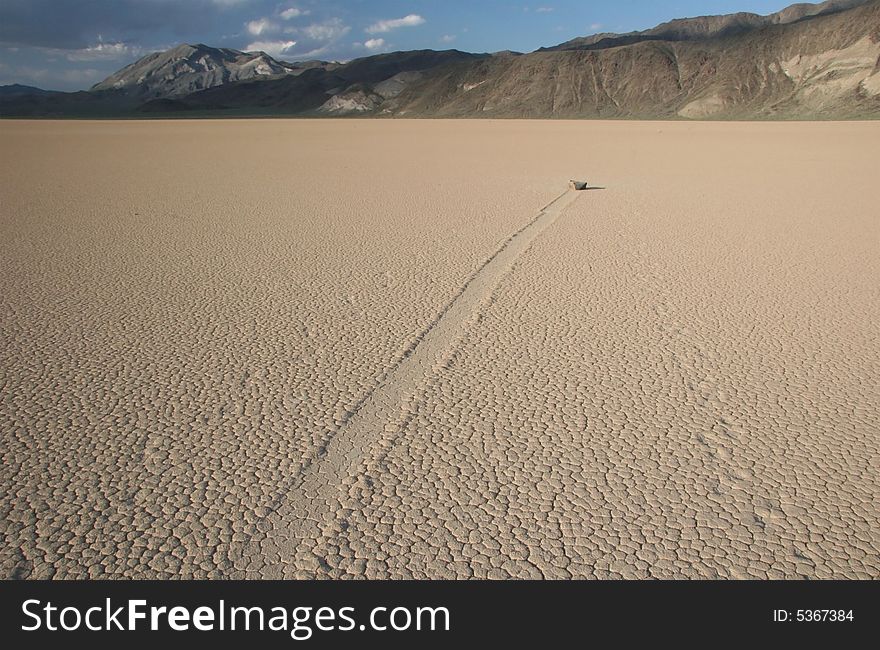 Famous natural phenomena moving stone in the desert of Death Valley national park. California. USA. Famous natural phenomena moving stone in the desert of Death Valley national park. California. USA
