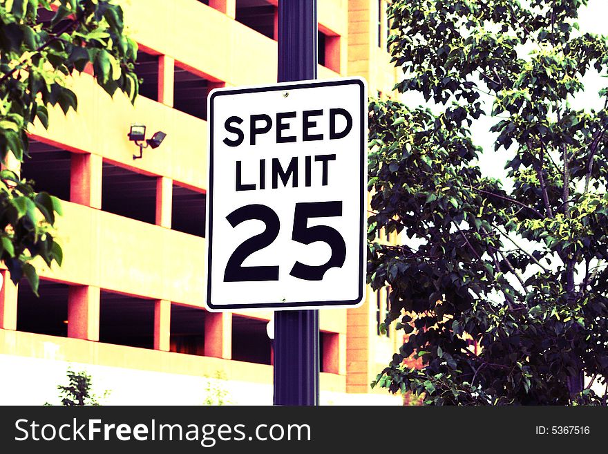 A speed limit board across the street