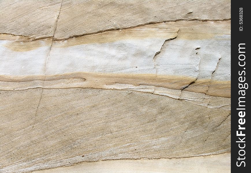 Photo of layered sandstone with cracks and texture. Photo of layered sandstone with cracks and texture.