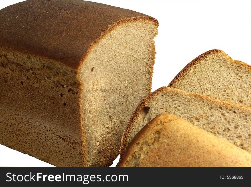 Crisp loaf of fresh rye bread cut on pieces. Crisp loaf of fresh rye bread cut on pieces.