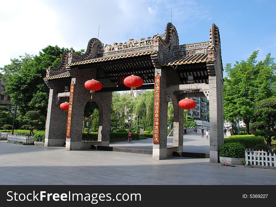 The Chinese ancient archway with tablets and red lanterns. The Chinese ancient archway with tablets and red lanterns.