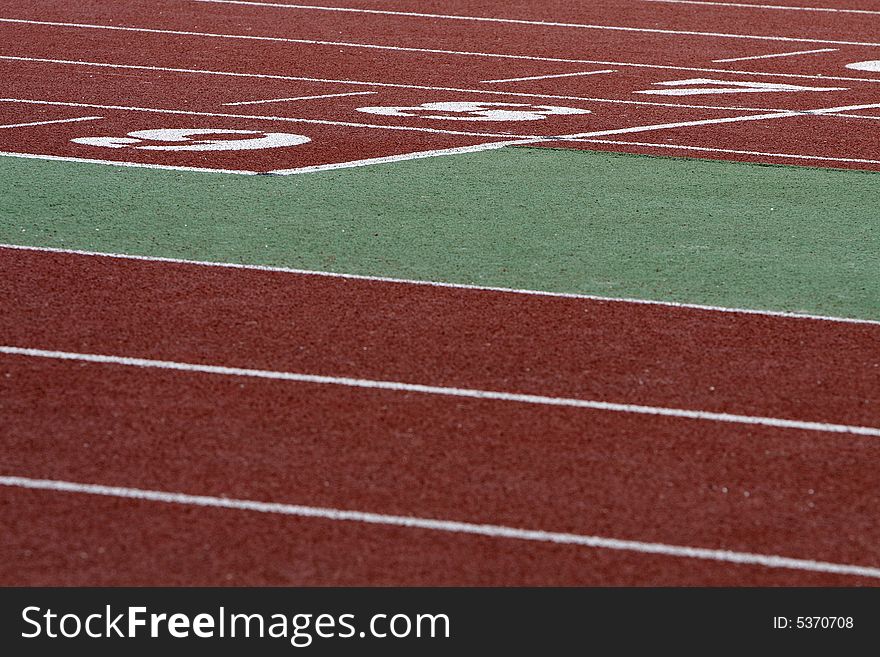 A part of athletics field with the numbers on it. A part of athletics field with the numbers on it