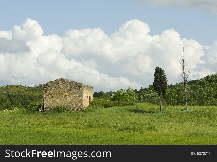 Typical Tuscany landscape with blue cloudy sky and cypresses. Typical Tuscany landscape with blue cloudy sky and cypresses