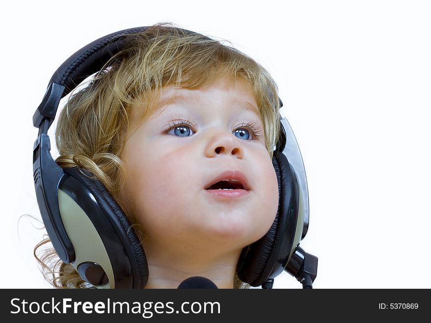 Portrait of young baby  listening music via phones. Portrait of young baby  listening music via phones