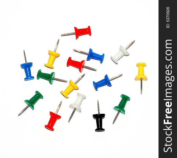 Colour stationary pushpin on the white background