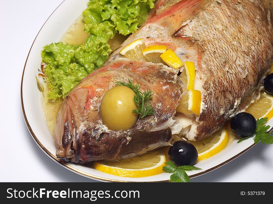 Baked perch fish with salad isolated. Baked perch fish with salad isolated