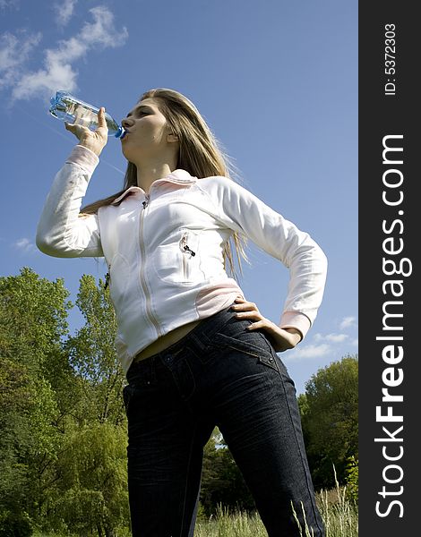 Girl drinking water from bottle