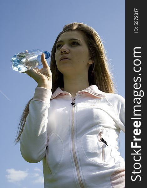 Girl drinking water from bottle