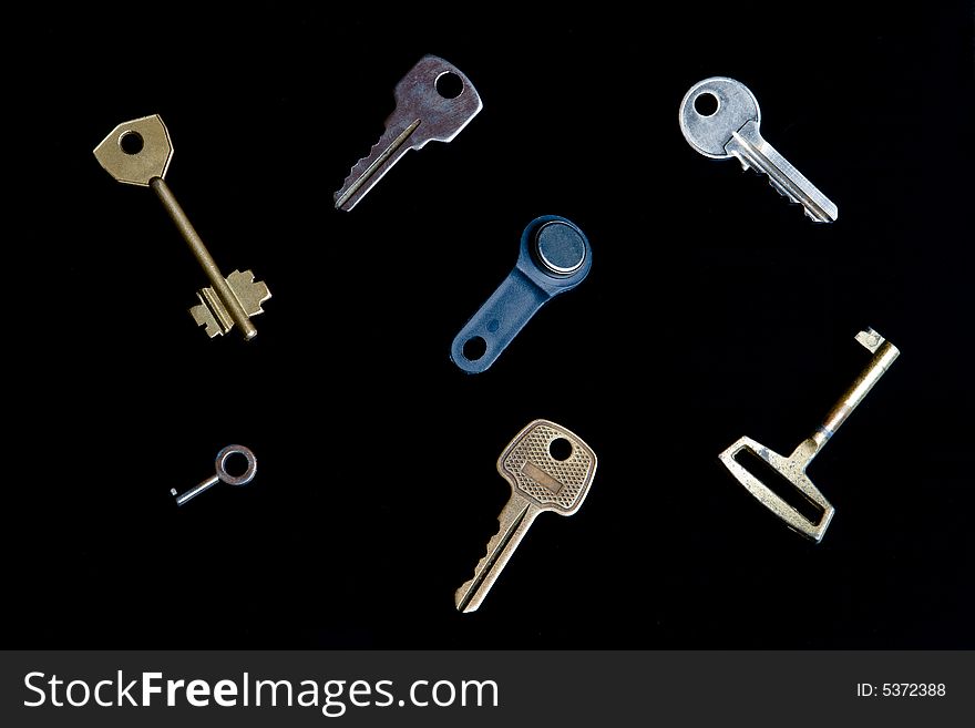 Keys from different locks isolated on a black background
