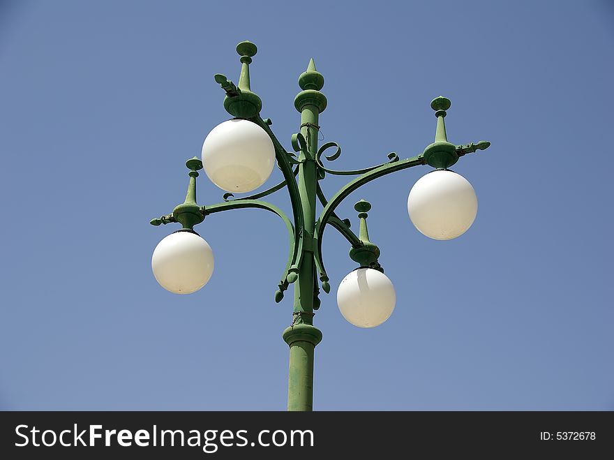 A street lamp over blue sky. A street lamp over blue sky