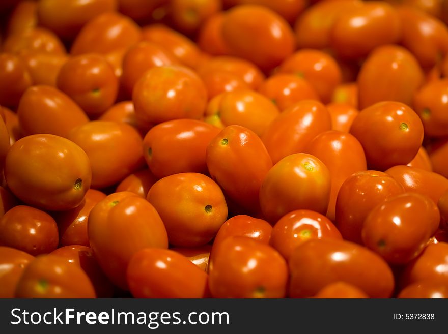 A close up of ripe organic roma tomatoes. A close up of ripe organic roma tomatoes