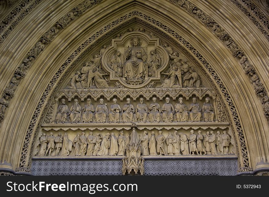 Detail showing God and the apostles in the entrance of Wetminster Abbey. Detail showing God and the apostles in the entrance of Wetminster Abbey