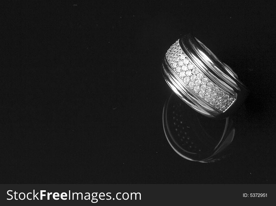 Diamond ring with reflection isolated over black background. Diamond ring with reflection isolated over black background