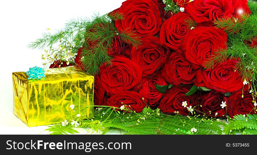 Red roses with a gift on a whiteness
