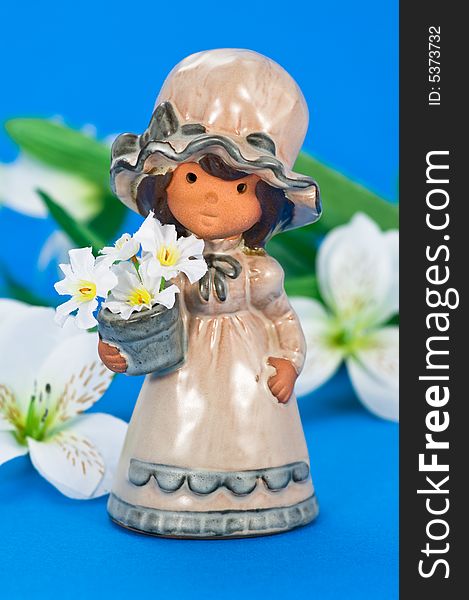 Flower girl with decoration flowers on blue background
