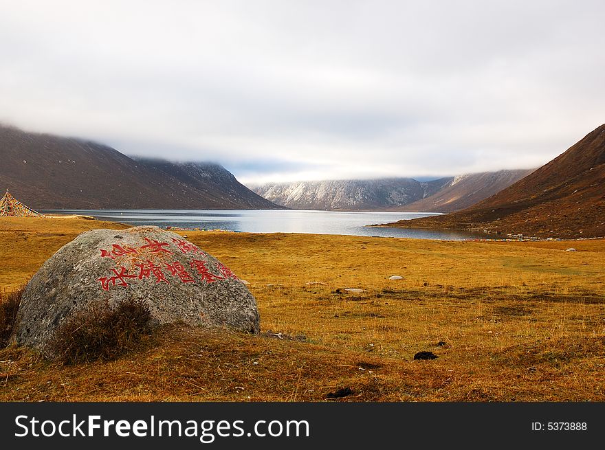 When travelling in Tibet of China in autumn,  meadows appear in front of us, and a lake on it is not far away from us. When travelling in Tibet of China in autumn,  meadows appear in front of us, and a lake on it is not far away from us.