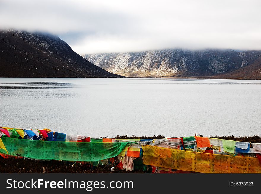 When travelling in Tibet of China, we saw a Tibet flag beside a lake.