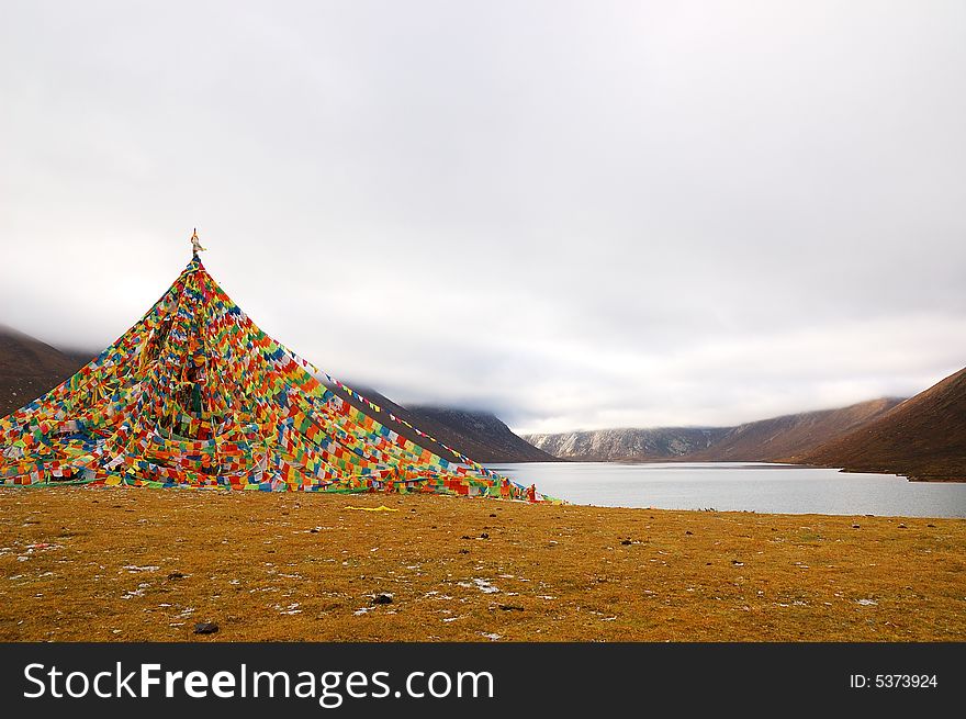 When travelling in Tibet of China, we saw a Tibet flag beside a lake.