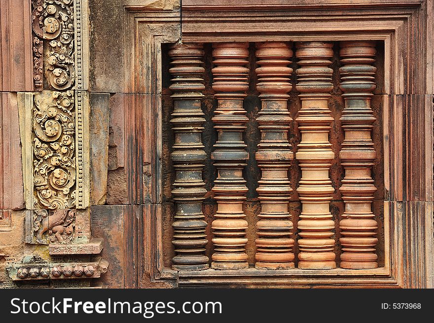 In Cambodia, in Angkor the 10th century temple of Banteay Srey was dedicated to the god Siva. The temple is known as �the jewel of the khmer art�. Here a traditional khmer window. In Cambodia, in Angkor the 10th century temple of Banteay Srey was dedicated to the god Siva. The temple is known as �the jewel of the khmer art�. Here a traditional khmer window