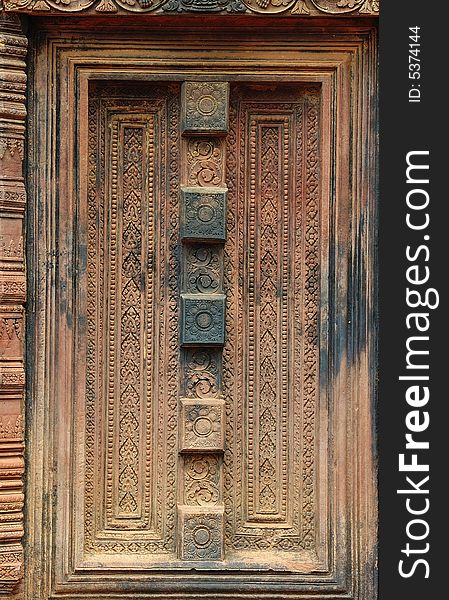 In Cambodia, in Angkor the 10th century temple of Banteay Srey was dedicated to the god Siva. The temple is known as �the jewel of the khmer art�. Here a false carved door. In Cambodia, in Angkor the 10th century temple of Banteay Srey was dedicated to the god Siva. The temple is known as �the jewel of the khmer art�. Here a false carved door
