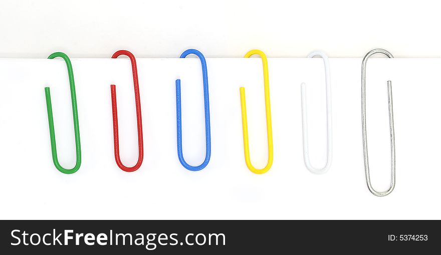 A variety of paperclips shot against a white background.