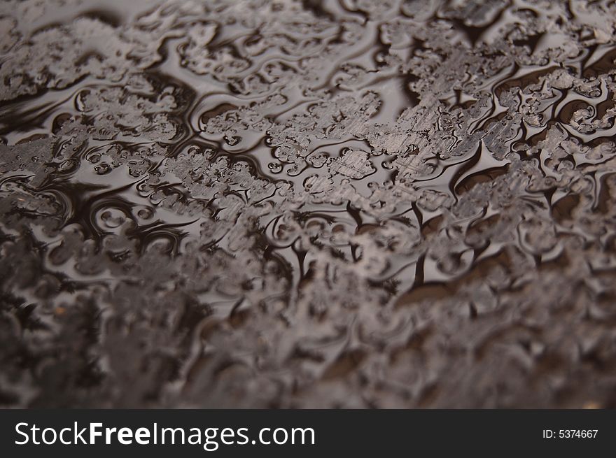 Water drops on a brown table. Water drops on a brown table