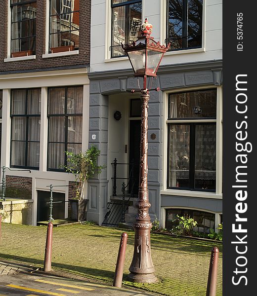 An historical lighting in one of Amsterdam narrow street. An historical lighting in one of Amsterdam narrow street