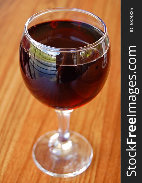 Glass of red wine on a table. Glass of red wine on a table