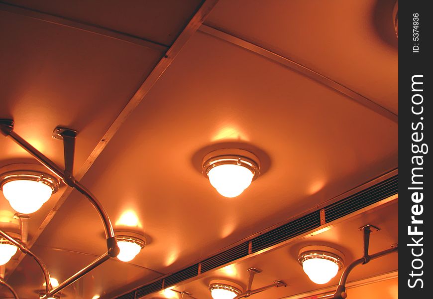 Ceiling, illumination and hand-rail of the transit vehicle of the underground
