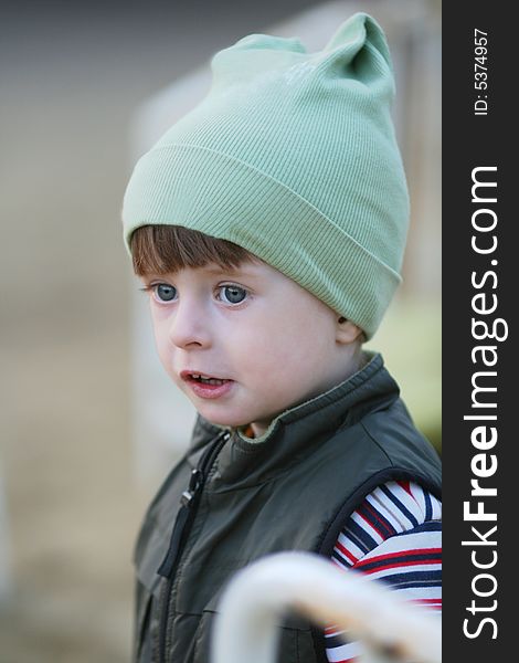 Portrait of the kid in a knitted cap