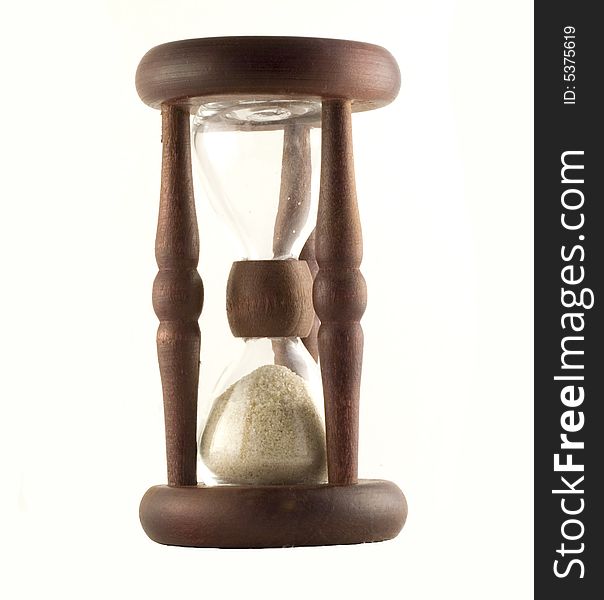 Ancient wooden sand-glass on white background