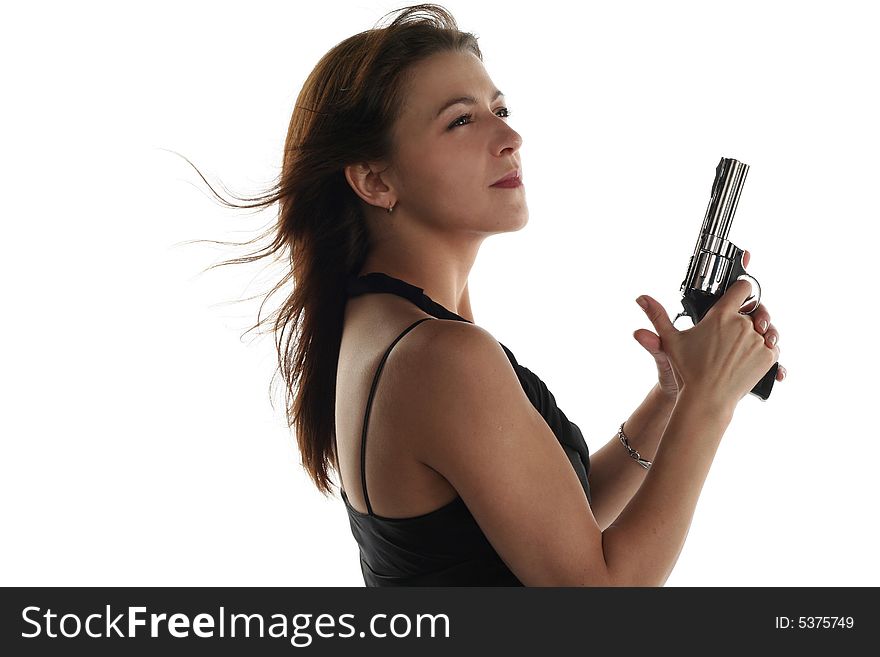 Young woman with revolver isolated on white background