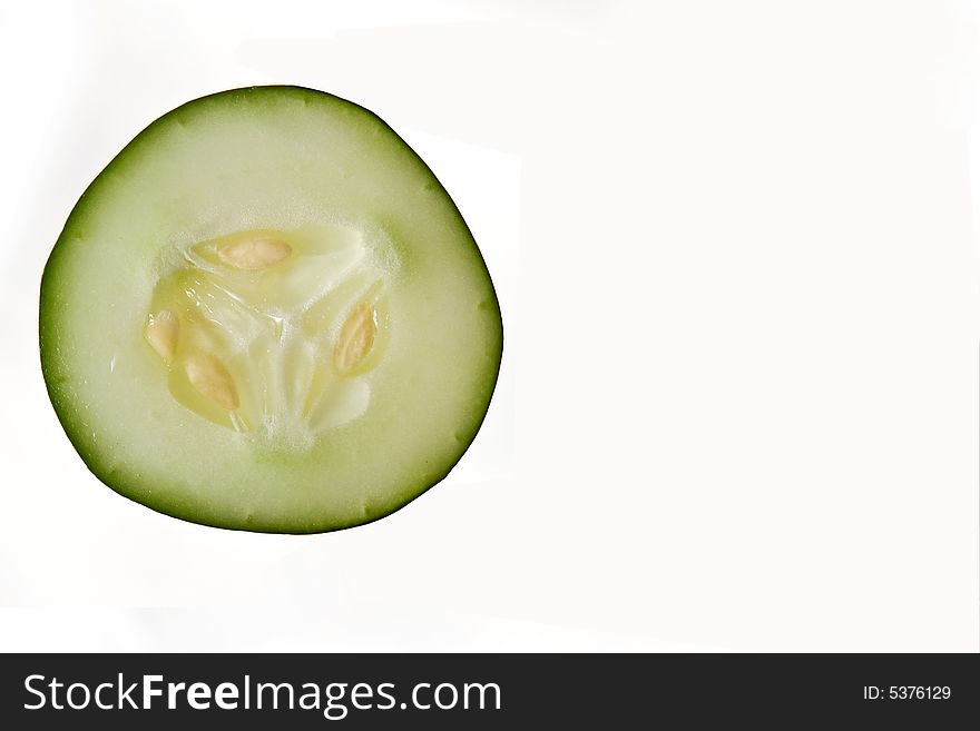 A wedge of cucumber used in a spa for avoiding aging and creating youth, isolated on white. A wedge of cucumber used in a spa for avoiding aging and creating youth, isolated on white