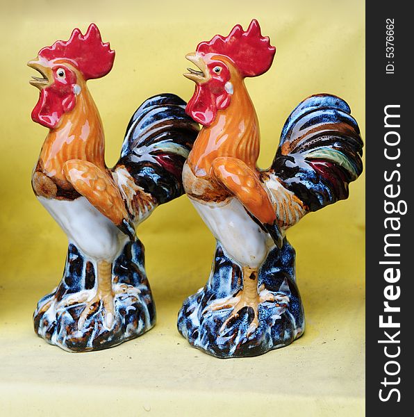 Two colorful ceramic roosters,chinese folk art，Foshan，Guangdong，China。. Two colorful ceramic roosters,chinese folk art，Foshan，Guangdong，China。