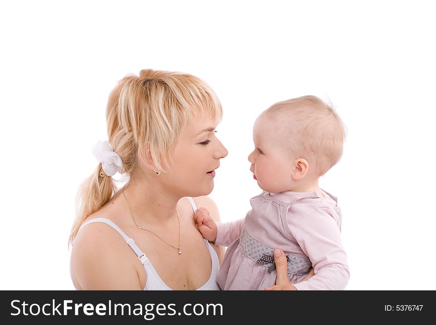 Mother hold baby girl and look at her eyes. Image isolated on white background. Mother hold baby girl and look at her eyes. Image isolated on white background