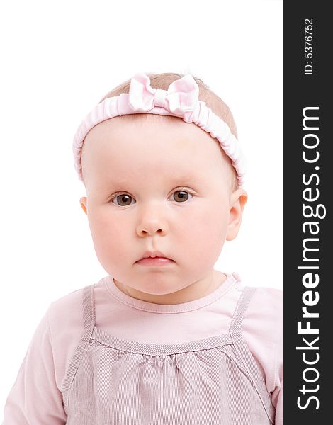 Baby girl with bowknot on head isolated on white background. Baby girl with bowknot on head isolated on white background