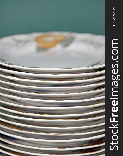 Stack of white dinner plates on white background. Stack of white dinner plates on white background.