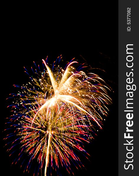Firework sparkling explosions isolated on black