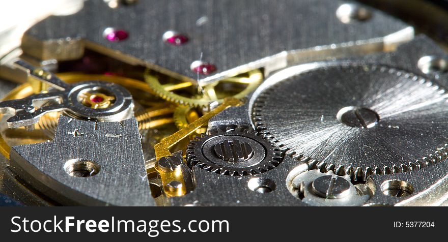 Close-up part of clock mechanism, shalow dof