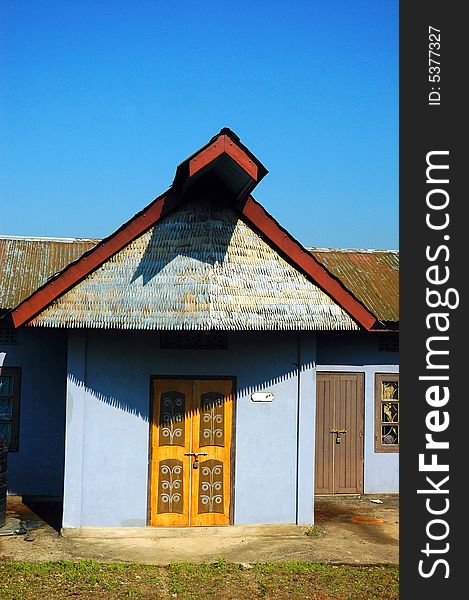 A colorful wooden hut of a Nagaland village. A colorful wooden hut of a Nagaland village.