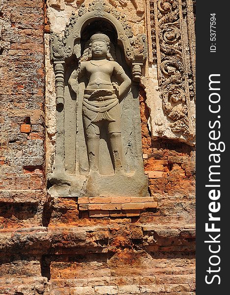 In Cambodia in the ancient city of Roulos the Hindu temple of Preah Ko orï¿½ The sacred bullï¿½ was built in the 9th century by the king Indravarman. View of a carved khmer guardian. In Cambodia in the ancient city of Roulos the Hindu temple of Preah Ko orï¿½ The sacred bullï¿½ was built in the 9th century by the king Indravarman. View of a carved khmer guardian