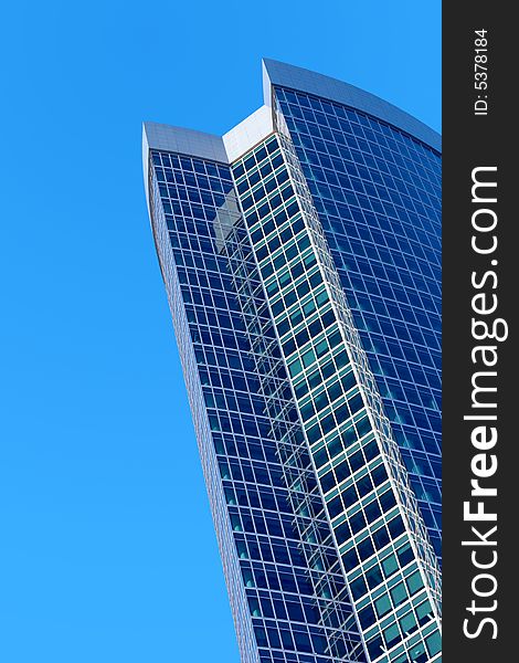 Skyscraper on a background of the blue sky. Skyscraper on a background of the blue sky