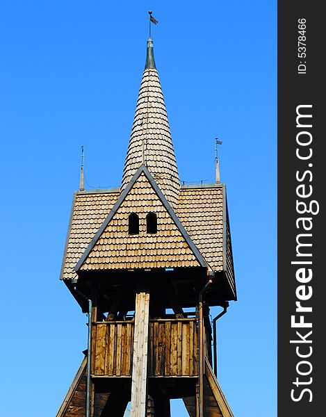 Vintage wood church tower and blue sky. Vintage wood church tower and blue sky