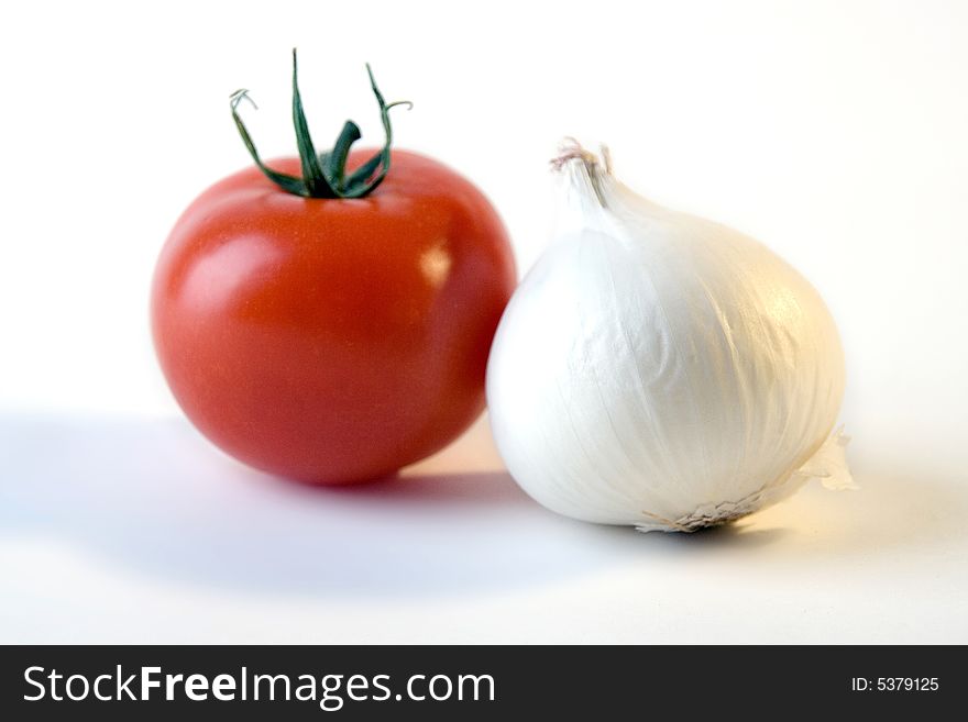 Fresh white onion and fresh red tomato. Fresh white onion and fresh red tomato